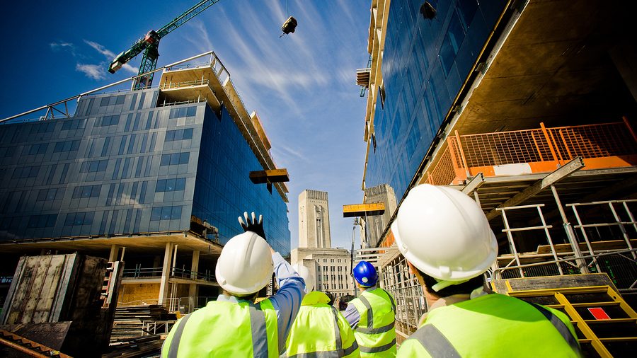 Construction workers monitoring the health and safety of their site